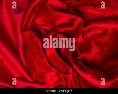Shiny red velvet texture for background, red rose shape,, love and passion concept Stock Photo