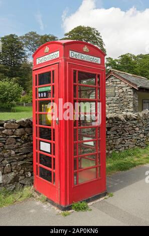 Defibrillator in former public telephone box. Stock Photo