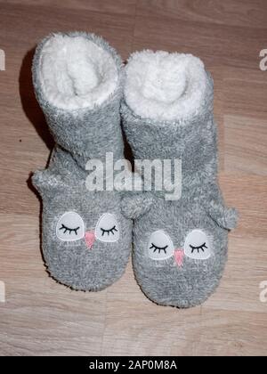 Soft and cute girl's footwear to keep warm; England; UK Stock Photo