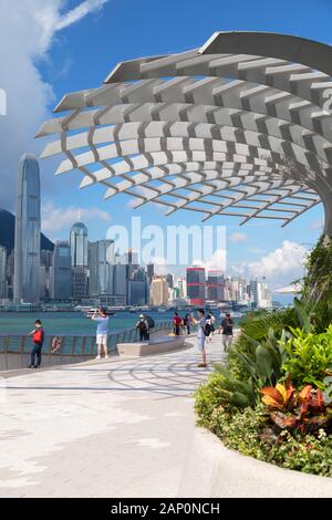 Hong Kong Island skyline and Tsim Sha Tsui promenade, Kowloon, Hong Kong Stock Photo