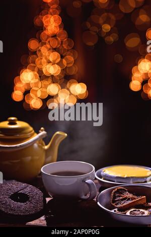 brewing tea in a festive christmas background Stock Photo