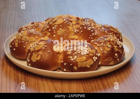Traditional Swiss three king cake. On 6th of January Swiss eat this bread and there is a little king hidden in one of the parts. Whole bread on a whit Stock Photo