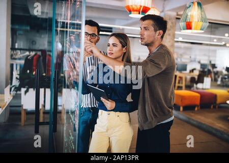 Creative brainstorming. Happy business people, designers, architects working as a team in office Stock Photo