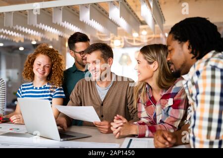 Group of successful business people designers architects in office Stock Photo
