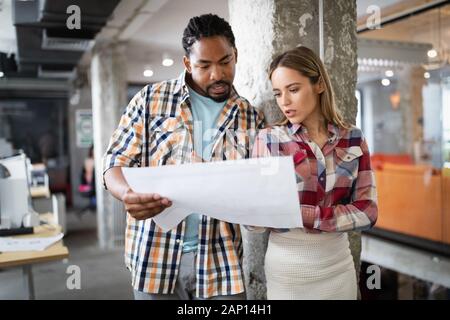 Business people designer architects teamwork brainstorming planning meeting concept Stock Photo