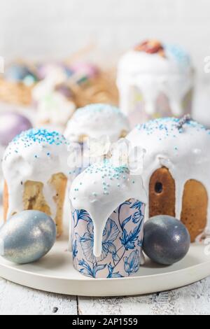 Easter table with Easter cakes and Easter eggs over white background Stock Photo