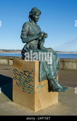 The Gansey Girl statue on Bridlington Harbour in East Yorkshire Stock Photo