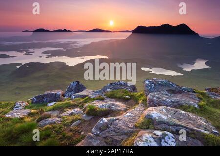 View of the mountains Suilven and Cul Mor at sunrise as seen from Stac Pollaidh. Sutherland, Scotland.. Stock Photo