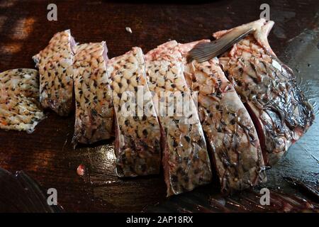 Freshly peeled carp fish on the table Stock Photo