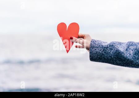 paper heart in hand Stock Photo