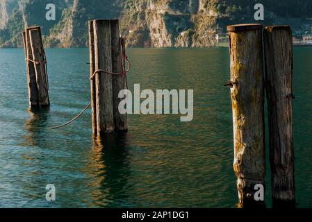 Mooring pylons on Lake Garda. Stock Photo