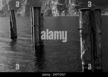 Mooring pylons on Lake Garda. Stock Photo