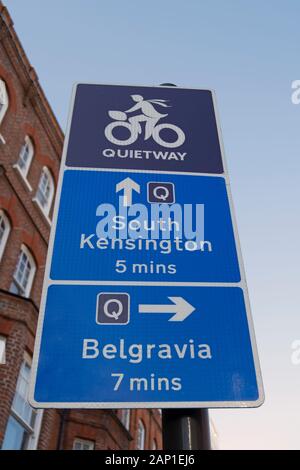 direction sign for a london cycle quietway route, giving directions and timings to south kensington and belgravia Stock Photo