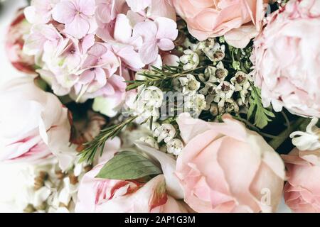 Decorative feminine floral composition. Closeup of pink roses petals, peonies, hydrangea ,chameleucium flowers. Selective focus, botany concept. Naura Stock Photo
