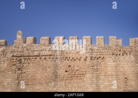 The fortress wall protecting the Acropolis of Lindos, Rhodes, Greece Stock Photo