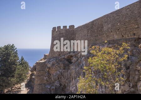 The fortress wall protecting the Acropolis of Lindos, Rhodes, Greece Stock Photo