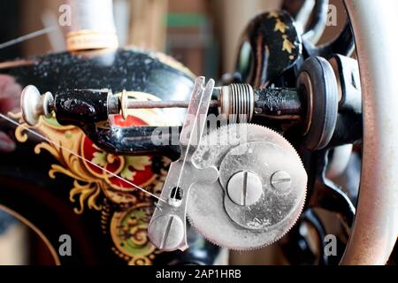 closeup of a heart shape cam and bobbin winder for a vintage sewing machine. Stock Photo