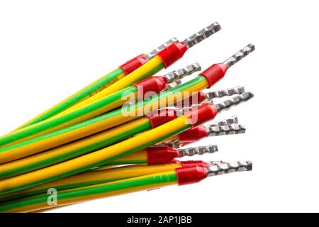 A bunch of yellow-green wires with prefab contacts, grounding cable or wire Stock Photo