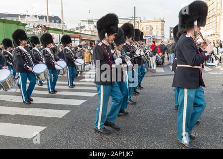 Copenhagen, Denmark - December 9, 2017: The procession of the royal guardsmen to the royal palace Amalienborg, accompanied by the orchestra. The cerem Stock Photo