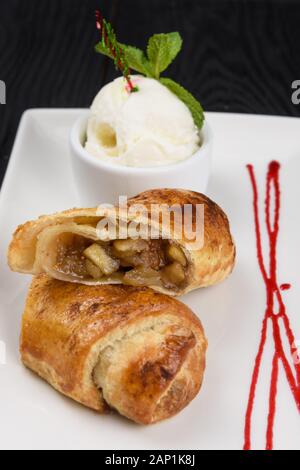 Apple strudel with vanilla ice cream Stock Photo