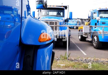 Parking of specialized vehicles. All trucks in in the same color. Stock Photo