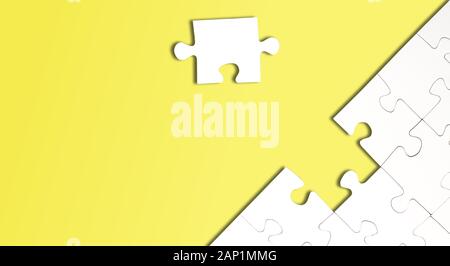 top view of jigsaw puzzle with one piece left on bright yellow background, completing a task or solving a problem concept Stock Photo