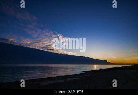 Shoreham-by-Sea UK 20th January 2020 - Dramatic clouds and sunset over the beach at Shoreham-by-Sea just west of Brighton in Sussex  . Credit: Simon Dack / Alamy Live News Stock Photo