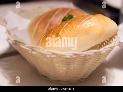 Brown Bakery as a Starter in wooden Basket background. Farmhouse Freshly Baked Bread Toast, Food Staple from natural organic ingredient, healthy Ameri Stock Photo
