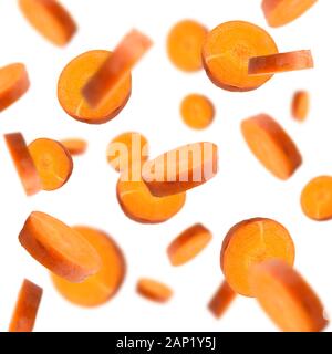 Flying fresh carrot isolated on white background Stock Photo