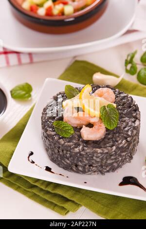 Squid ink risotto. Stock Photo