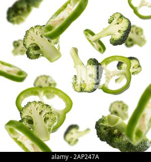 Flying broccoli slices isolated on white background Stock Photo