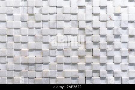 Mosaic tile from of natural white marble. Wall panel from white quartz. Stock Photo