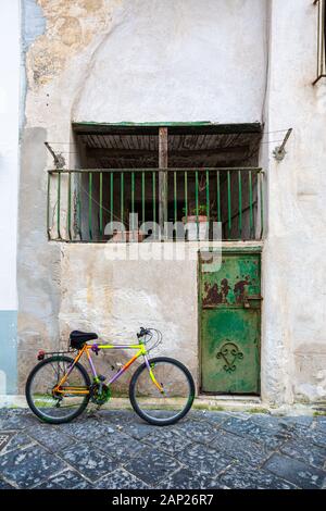 Procida (Italy) - Colored walls and bike in Procida, a little island in Campania, southern Italy Stock Photo