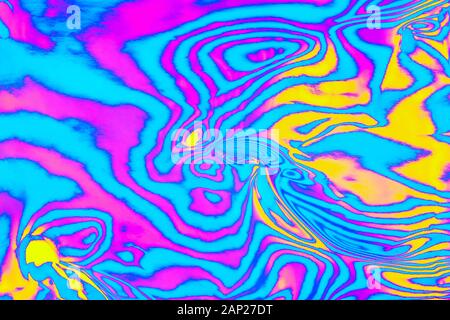 Abstract trendy neon colored psychedelic fluorescent striped zebra textured neon background Stock Photo