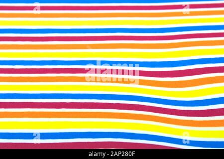 Image of a horizontal striped background surface that combines various colors such as red, blue, orange, yellow, white Stock Photo