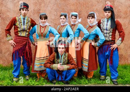 National Armenian Dances Golden Apricot guys and a girl on the holiday day of the city of Tuapse 2/07/2011 Stock Photo