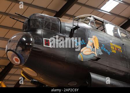 The nose and nose art of Just Jane, a second world war Lancaster Bomber from WW2, Lincolnshire Aviation Heritage Centre, East Kirkby Lincolnshire UK Stock Photo