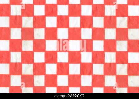 Close up of a Red and White Checkered Square Sheet, Wax Paper Food Basket Liner. Stock Photo