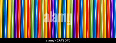 Many different colored plastic drinking straws vertically arranged, panoramic image Stock Photo