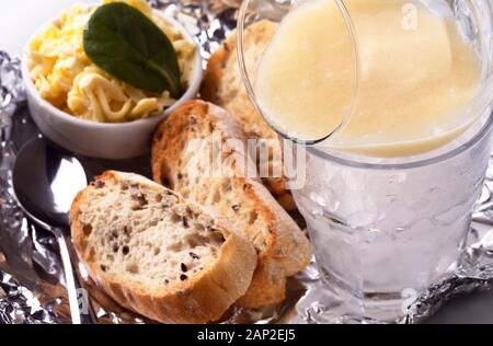 Pike caviar on dry ice with toast of toasted bread and butter, close- up image Stock Photo