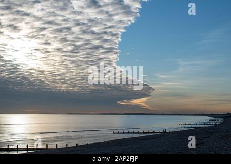 Spectacular cloud formation over the seafront at Bognor Regis, beautiful colours and reflections of the sea. Stock Photo