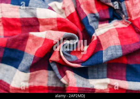 Plaid material texture. Red, blue and white cage clothes background Stock Photo