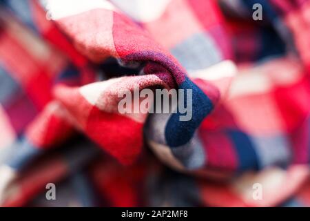 Plaid material texture. Red, blue and white cage clothes background Stock Photo