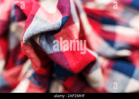 Plaid material texture. Red, blue and white cage clothes background Stock Photo