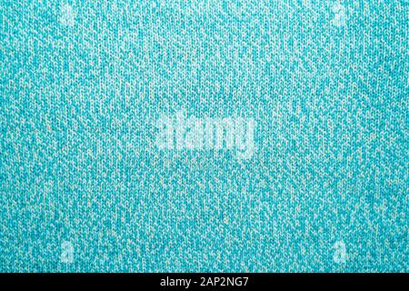 The texture of a blue turquoise knitted fabric. Sweater background Stock Photo
