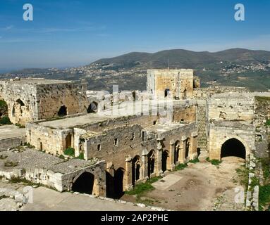 Syria Arab Republic. Krak des Chevaliers. Crusader castle, under control of Knights Hospitaller (1142-1271) during the Crusades to the Holy Land, fell into Arab control in the 13th century. Ruins of the reception hall and gallery. Photo taken before Syrian Civil War. Stock Photo