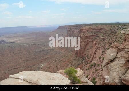 Summer in Utah: Looking Toward Grand View Point at the End of the Island in the Sky Plateau from Buck Canyon Overlook in Canyonlands National Park Stock Photo