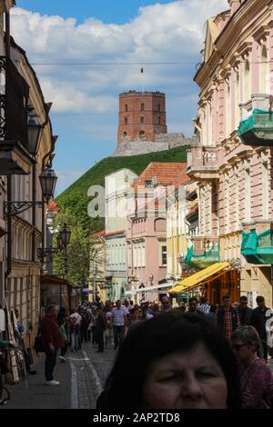 Street view with Gedimina's Tower in the background in Vilnius, Lithuania Stock Photo