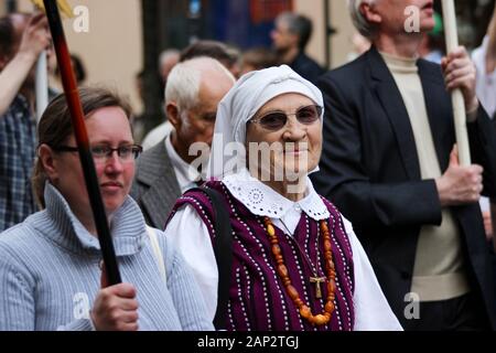 Elderly woman in a national costume at parade in Vilnius, Lithuania Stock Photo