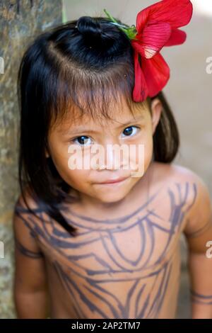Beautiful children playing and posing for the tourist in the Embera Indigenous Village in the Charges National Park, Panama. Stock Photo